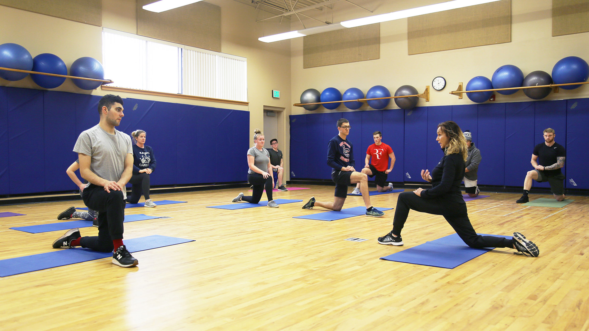 Kinesiology class with students stretching